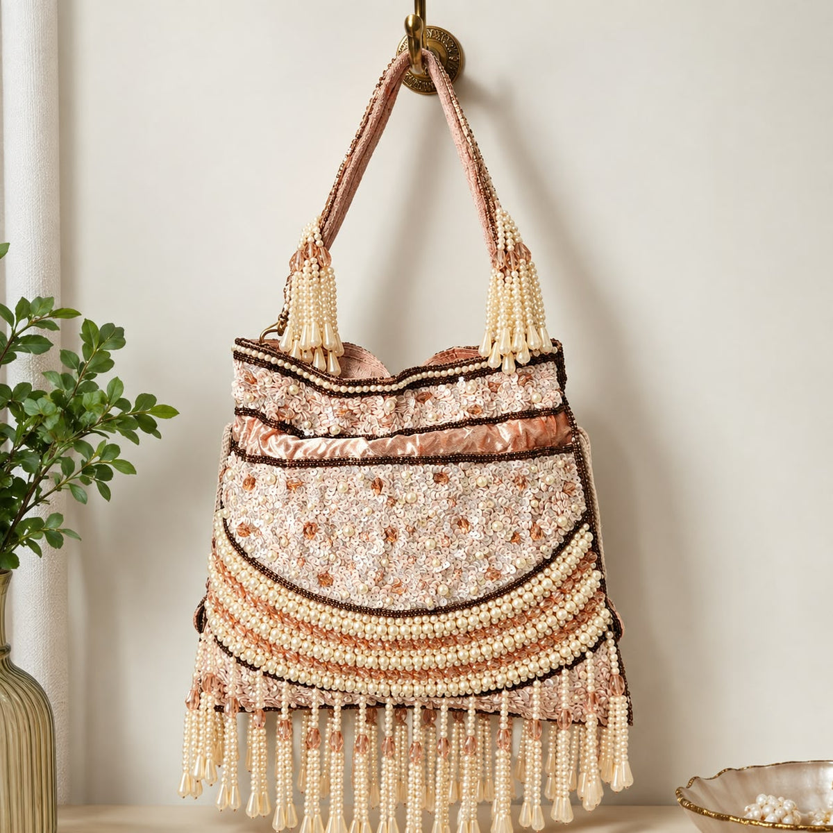 Luxury Rose Gold Beaded Potli Purse with Cascading Bead Fringe.